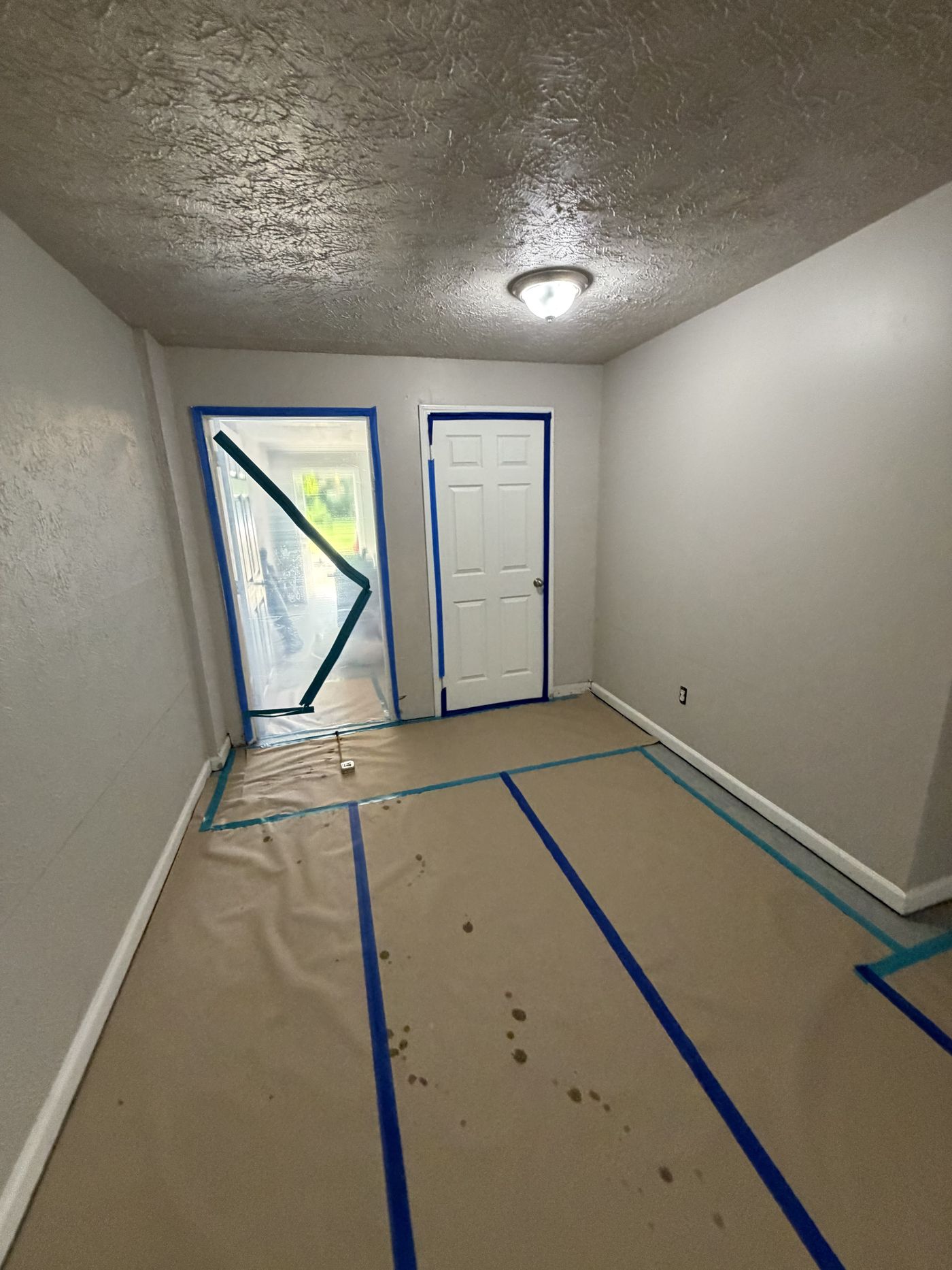 Sealed containment doorway with poly sheeting